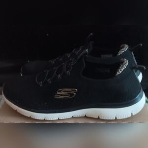 Skechers Black Knit Slip-On Sneaker with White Sole and Gold Logo